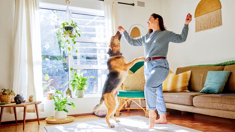 womenPlayingwithDog
