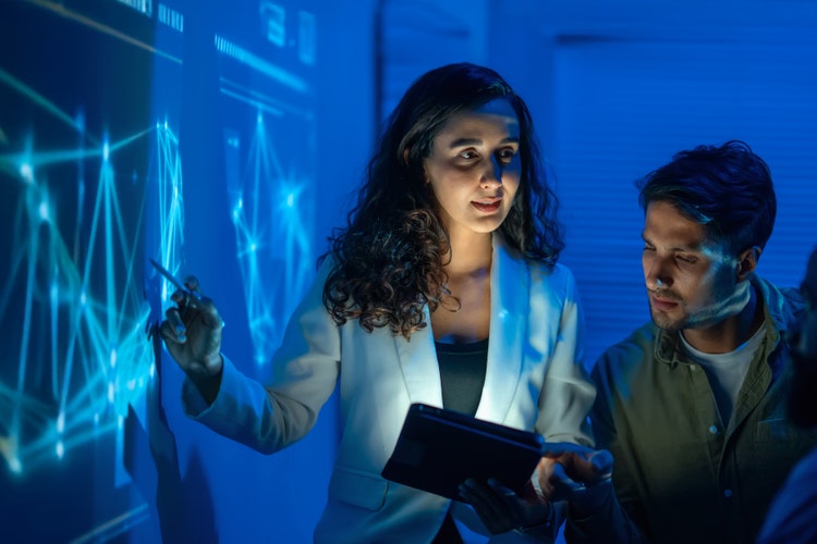 woman pointing at data on screen using artificial intelligence