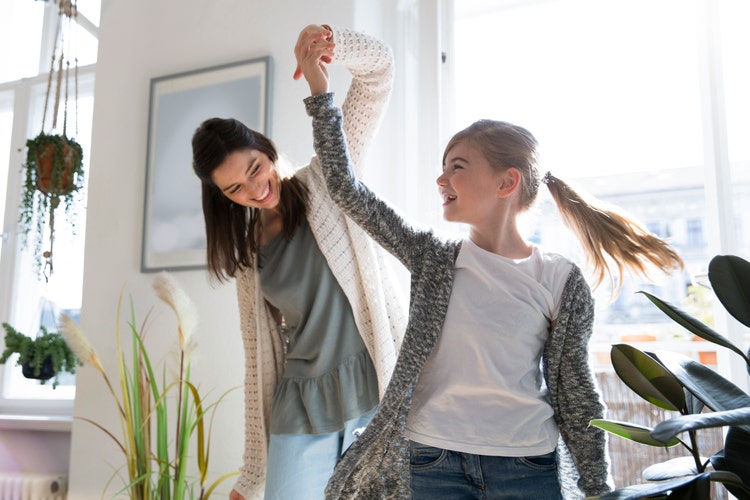 Woman dancing with child
