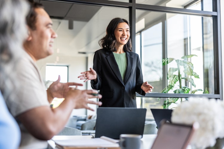 woman presenting at a meeting